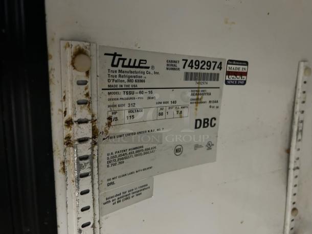 Label on True TSSU-60-16-HC 2-door refrigerated prep table. Shows model details and serial number 7492974. Made in USA.