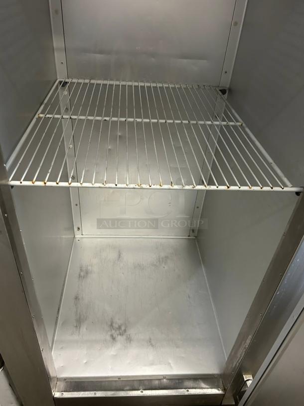 Traulsen G10010 30" G Series solid door reach-in refrigerator interior, clean condition, metal shelving, tested and working.