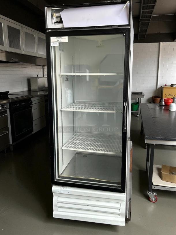 Everest Refrigeration EMGR24 28-inch reach-in fridge with glass door, good condition, tested and working, interior shelves visible.