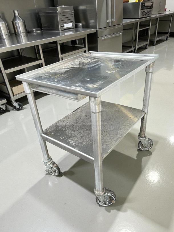 GSW all stainless steel equipment stand, perfect condition, with heavy-duty casters for easy swivel.