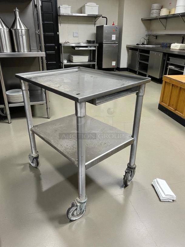 Stainless steel equipment stand with casters, GSW brand, perfect condition, heavy-duty, easy swivel wheels.