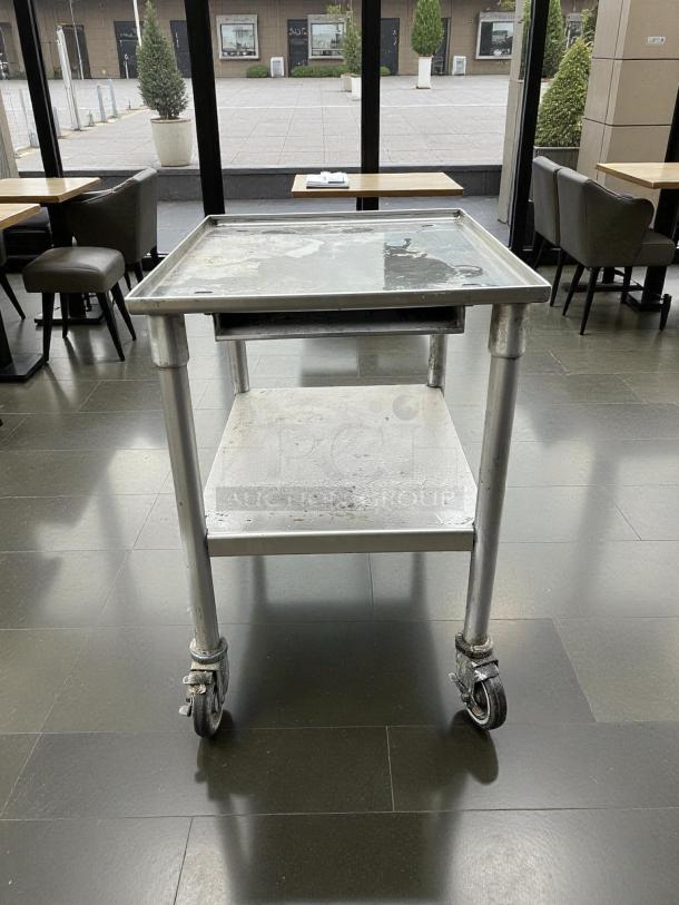 GSW stainless steel equipment stand with casters, perfect condition. Heavy-duty, easy swivel, dual shelves.