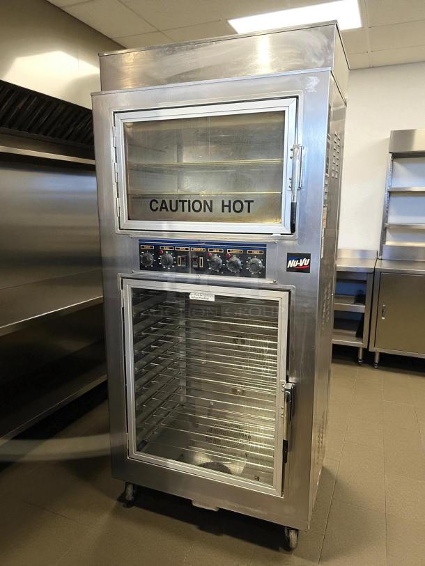 NU-VU QB-3/9 double deck oven proofer combo in excellent condition. Features control knobs, glass doors, and caution hot label.