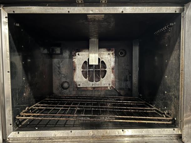 Wolf by Vulcan WC44GD-11D3 double deck gas convection oven, tested working, used condition. Interior view with racks.