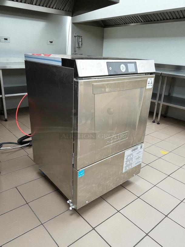 Hobart LXNH-2 high temp undercounter dishwasher in excellent condition. Features 48 racks/hr capacity, built-in booster.