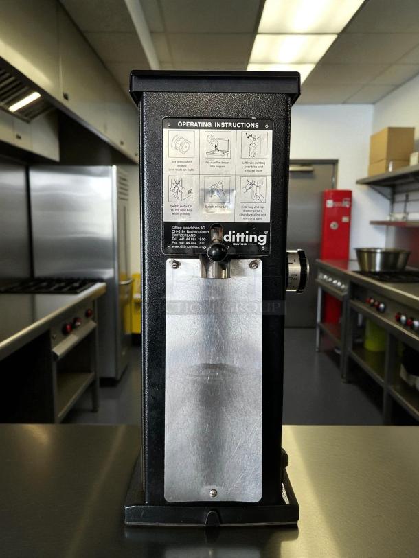 Ditting KR1203 commercial coffee grinder in great condition, showing operating instructions and brand label, tested and working.