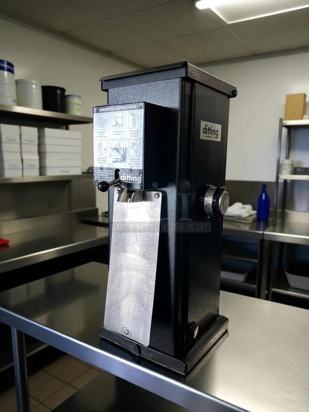 Ditting KR1203 commercial coffee grinder in great condition, black finish, tested and working. Features operating instructions.