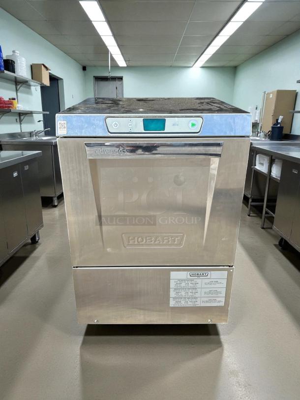 Hobart LXNH-1 undercounter dishwasher in excellent condition. High-temperature model, tested and working. Visible control panel and labels.