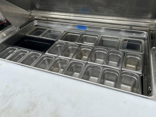 Randell 9030K-513 48" two-door refrigerated counter with multiple metal pans, labeled "Salsa," excellent condition.
