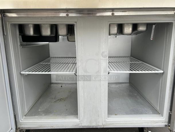 Randell 9030K-513, 48" wide two-section, two-door reach-in refrigerated counter in excellent condition, shelves shown.