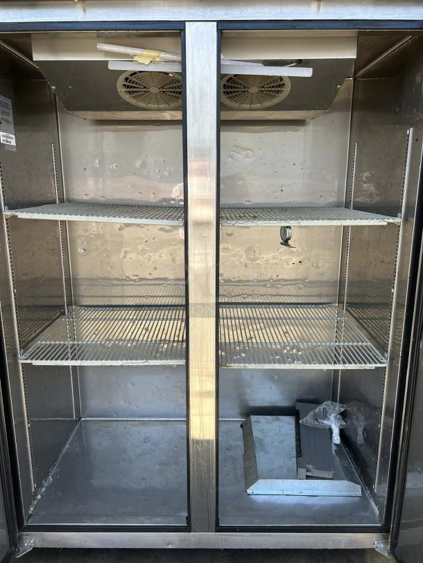 Turbo Air M3F47-2-N reach-in freezer with solid doors, three shelves, tested and working condition, model tag visible.
