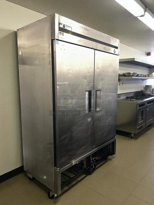 True T-49-HC solid door reach-in refrigerator, 54 1/8", tested and working, stainless steel, sturdy handles, on casters.
