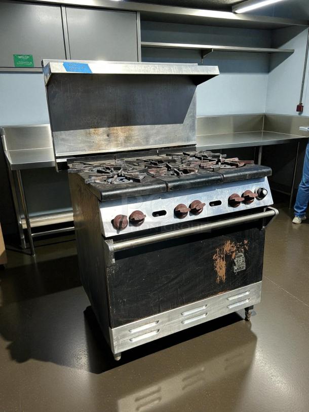 Wolf Commercial WX36-6B range; 36" gas, 6 burners, 28 KBTU each. Excellent condition, tested, minor surface wear.