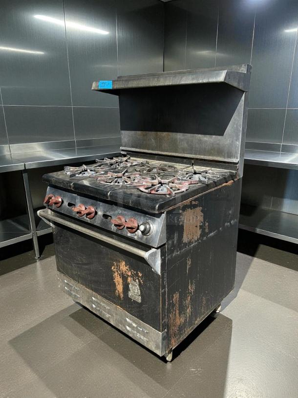 Wolf WX36-6B 36" gas range, 6 burners, 28K BTU, tested working, visible wear, ideal for commercial kitchens.
