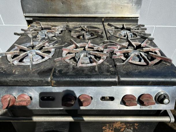 Wolf WX36-6B Gas Range with 6 burners, excellent condition. Features 28 KBTU burners, tested and working. Commercial design.