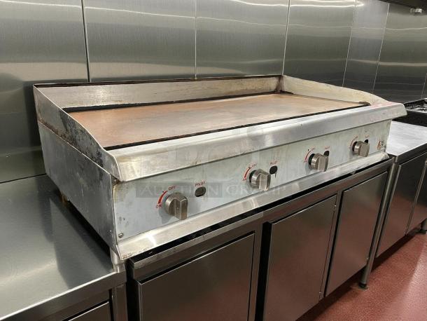 Cooking Performance Group GM-CPG-48-NL 48" gas countertop griddle with manual controls, stainless steel, used condition.