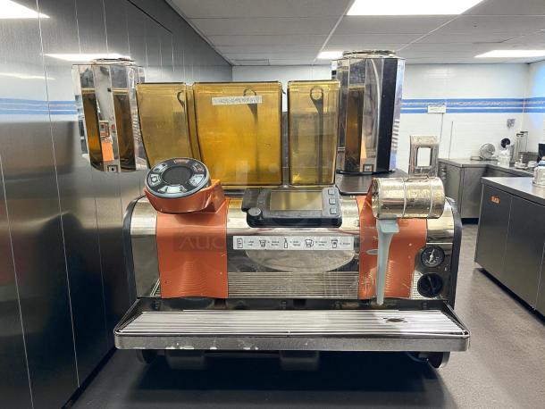 Thermoplan Mastrena II espresso machine, tested and working. Features dual hoppers, control panel, pump. 209-240v, 1ph.