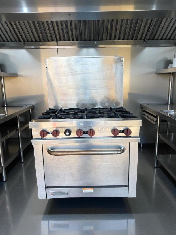 Wolf WX36-6BP 36" 6 burner gas range with standard oven in excellent condition; tested and working flawlessly.