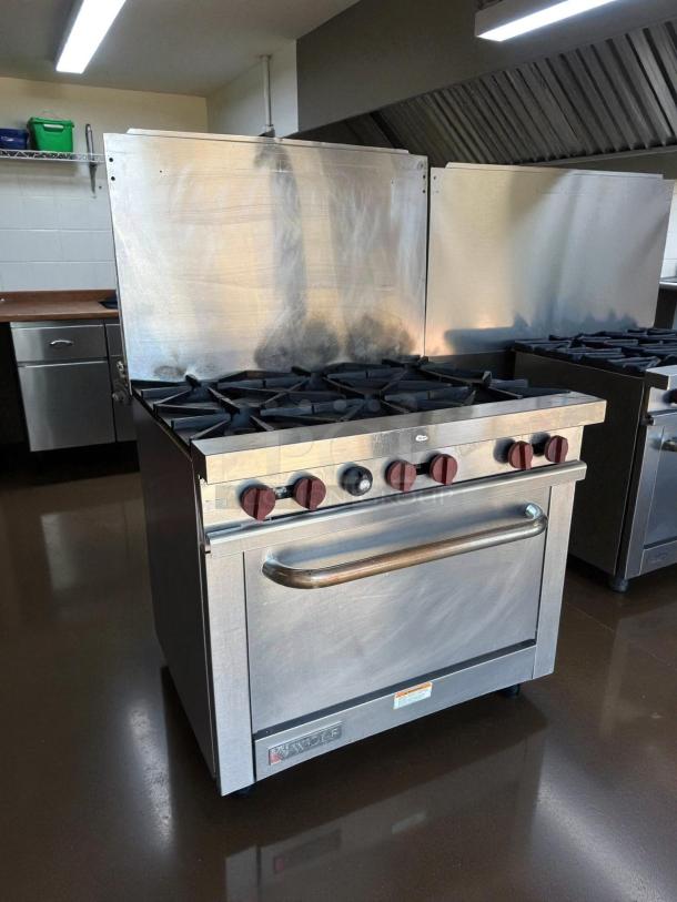 Wolf WX36-6BP 36" gas range with 6 burners, standard oven; excellent condition, tested and working, stainless steel.