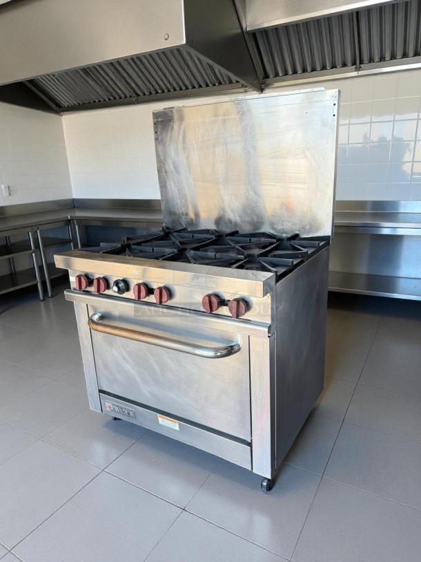 Wolf WX36-6BP 36" 6 Burner Gas Range with standard oven in excellent condition, stainless steel, tested and working.