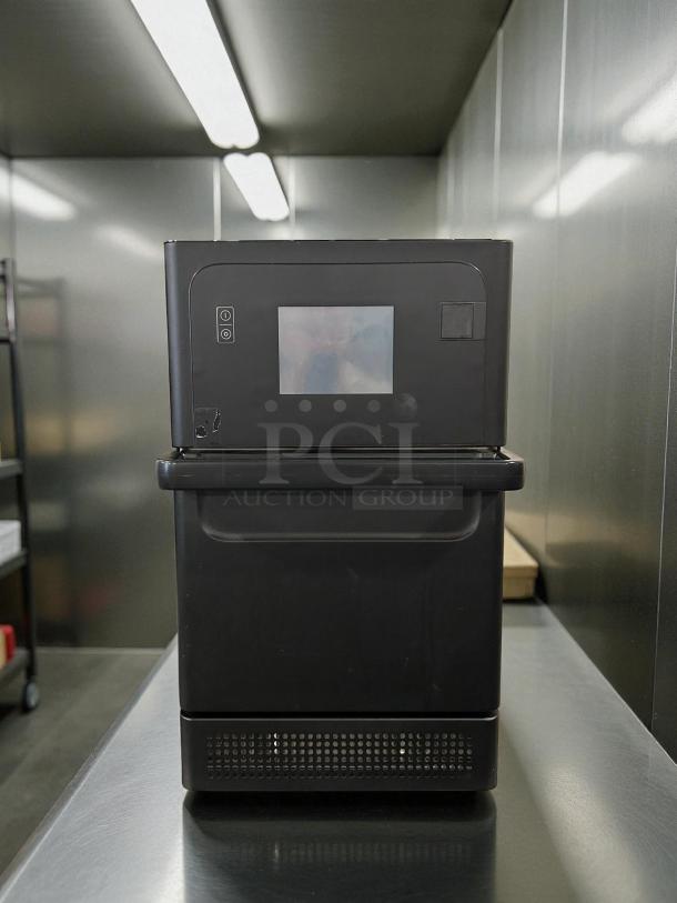Merrychef eikon e1s high-speed countertop oven in excellent condition, tested and working, with digital display and buttons.