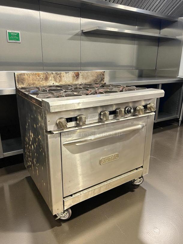Royal Range RR-6 36" gas restaurant range with 6 open burners and standard oven. Tested, working condition. Durable metal finish.