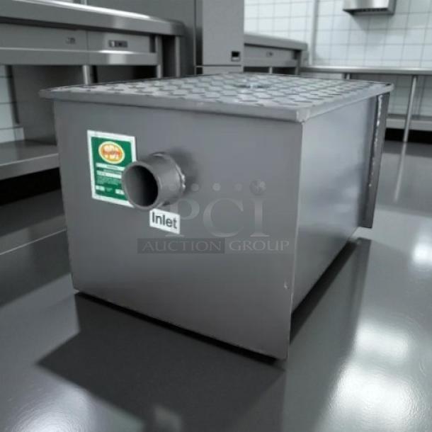 PDI Universal LJ-20 grease interceptor, 20 lbs./10 GPM capacity, stainless steel, inlet label visible, excellent condition.
