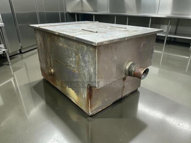 PDI Universal LJ-20 grease interceptor, 20 lbs. capacity, 10 GPM, tested, working, visible rust, "OUT" labeled outlet.