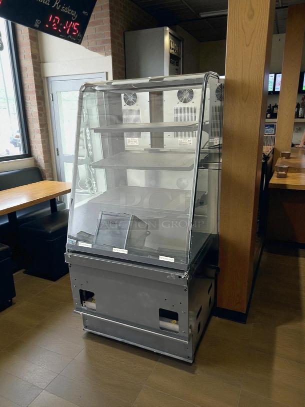 Structural Concepts dry pastry/bread display case, clear glass, multiple shelves, gray base, tested and working condition.