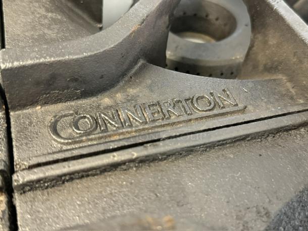 Connerton CN36-6 36" gas restaurant range detail, showing embossed brand name "CONNERTON," in great condition.
