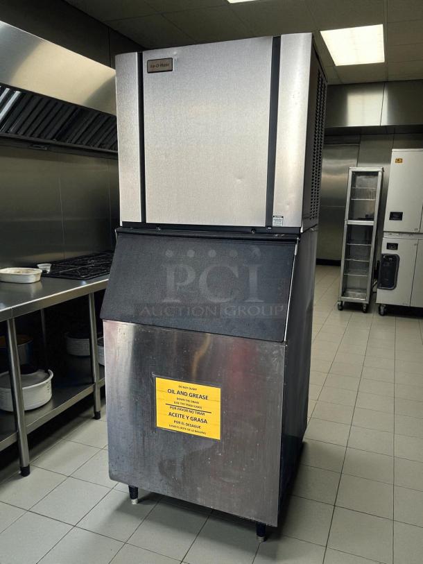 Ice-O-Matic CIM1136HA ice machine, tested and working, produces 932 lbs of half-cube ice. Features "oil and grease" warning label.