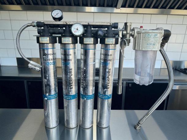 Everpure EV932504 Ice Machine Water Filter System, tested, working, features four cartridges, pressure gauges, metal hoses.