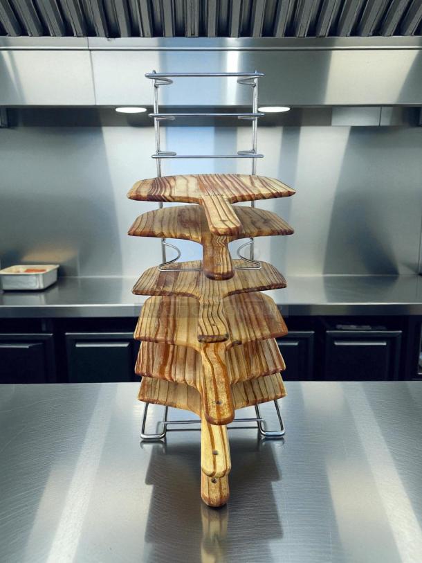 Choice 10-slot pizza pan rack, model 407prack10so, in great condition on a stainless steel surface.