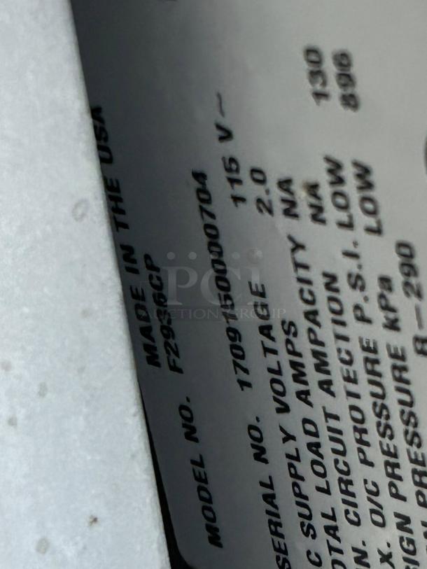 Label on Delfield F2936CP Chef Base, includes model number, voltage 115V, serial number 1709150000704, excellent condition.