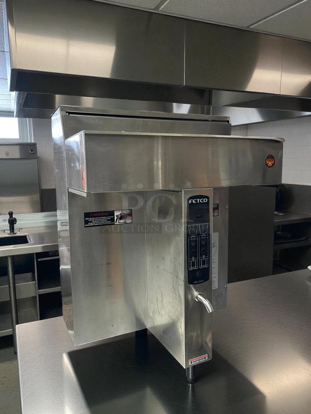 Fetco CBS-2032e Coffee Brewer, stainless steel, excellent condition, tested, 1-gallon capacity, visible control panel displays.