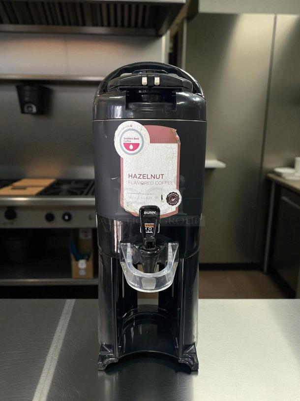 BUNN TF Server coffee brewer, great condition, with funnel locks. Features a Hazelnut flavor label, tested and working.