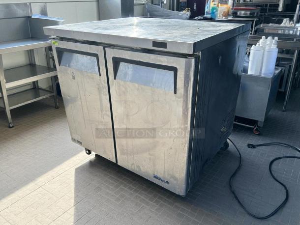 Turbo Air MUF-36-N 36" undercounter freezer with two doors, stainless steel, tested, fully working, 115V, visible wear.