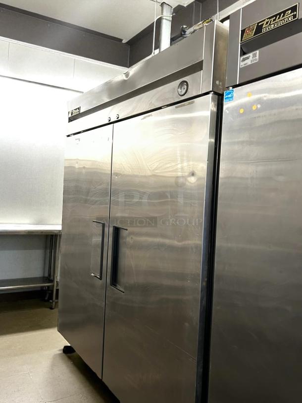 True T-49-HC solid door reach-in refrigerator, stainless steel, excellent condition, tested and working, 54 1/8" wide.