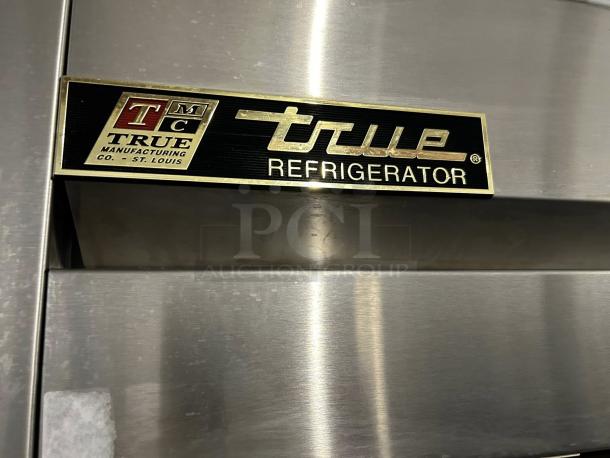 True T-49-HC reach-in refrigerator, excellent condition, solid door, 54 1/8", tested and working, True Manufacturing label visible.