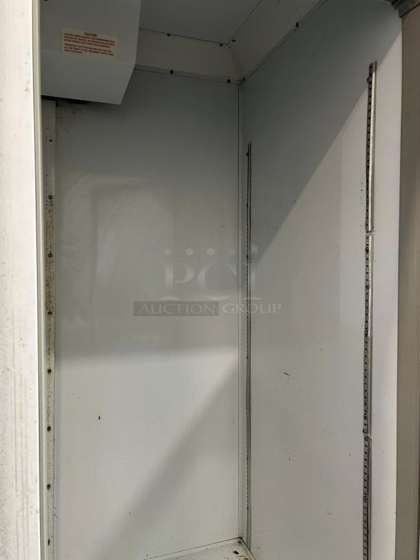 Beverage-Air CRG74-1 commercial refrigerator interior, showing clean shelving grooves. Good condition, 115V, recently tested.