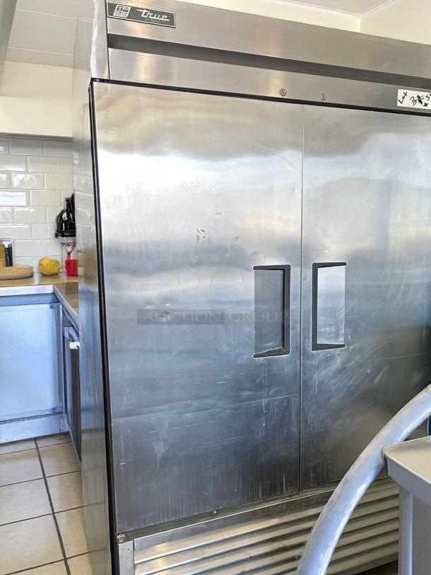 True T-72-HC 78 1/8" 3-door reach-in refrigerator, stainless steel, tested and working, visible surface marks, lot tag.