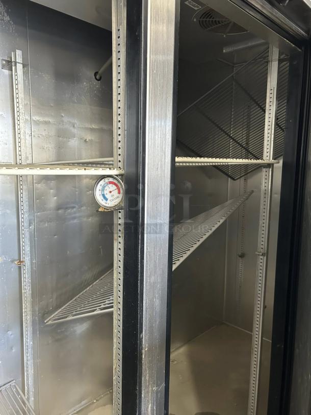 True T-72-HC 3-door reach-in refrigerator, solid doors, tested and working, features shelving and temperature gauge.