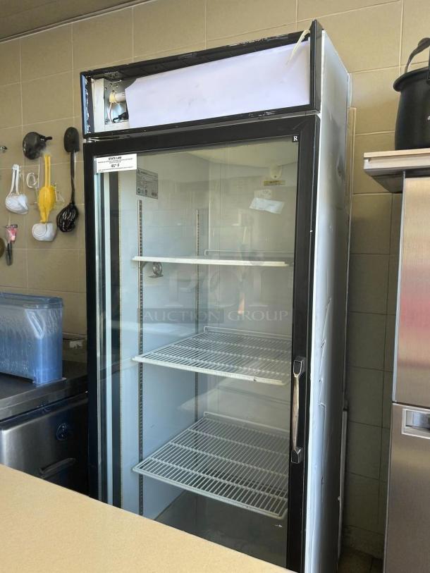 Everest EMGR24 glass door refrigerator, single swing, 115V. Tested and working, features shelves for storage.