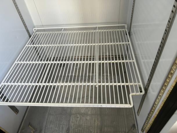 Everest EMGR24 glass door refrigerator interior showing metal shelf, adjustable brackets, and clean condition.