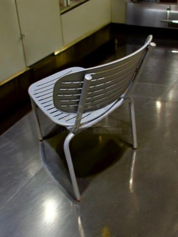 Lot of 7 blue metal patio chairs, slatted steel design, very good condition, durable outdoor seating by Commercial Outdoor Furniture.