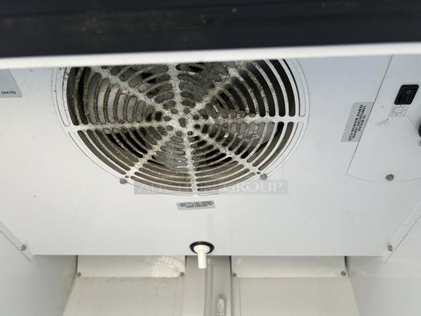 "True GDM-23-HC-TSL01 merchandiser refrigerator interior fan, showing excellent condition and visible test label, 115V power."