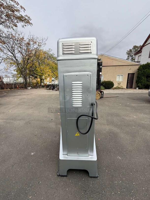 Preppal by Atosa PPM-60 Heavy Duty Floor Mixer, silver, side view, showing vented panel and power cord, in outdoor setting.