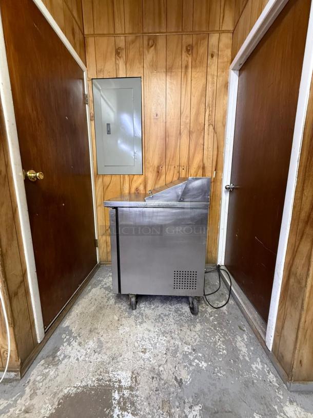 True TSSU-27-08-HC refrigerated sandwich prep table, right hinged door, stainless steel, wheeled base, fair condition.