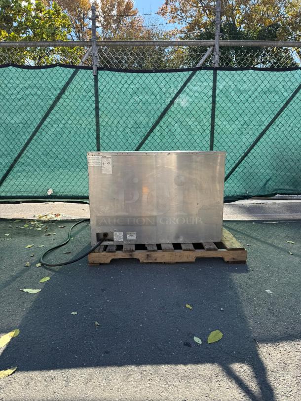 Bakers Pride EP-2-2828 double deck electric pizza oven on a pallet, stainless steel, visible power cord.