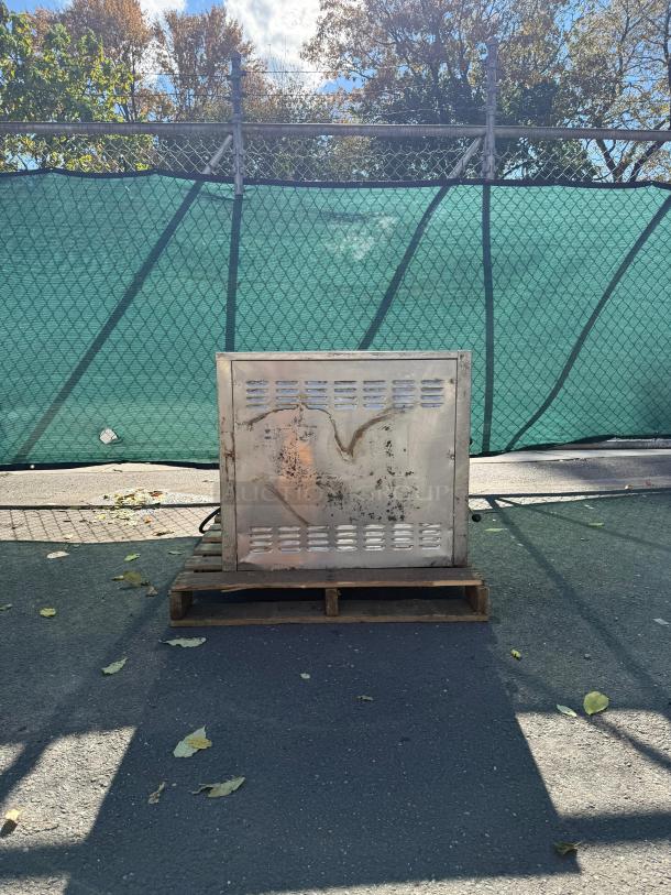 Bakers Pride EP-2-2828 Double Deck Electric Pizza Oven on pallet; visible wear. Model EP-2-2828; stainless steel exterior.